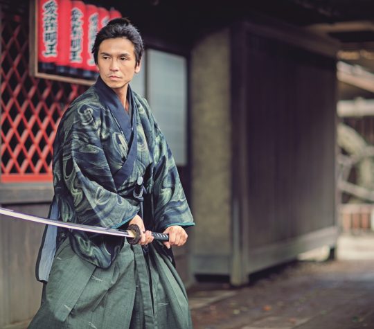 The Samurai Traditional Japanese Ronin Samurai is entering in the yard ready for action.
