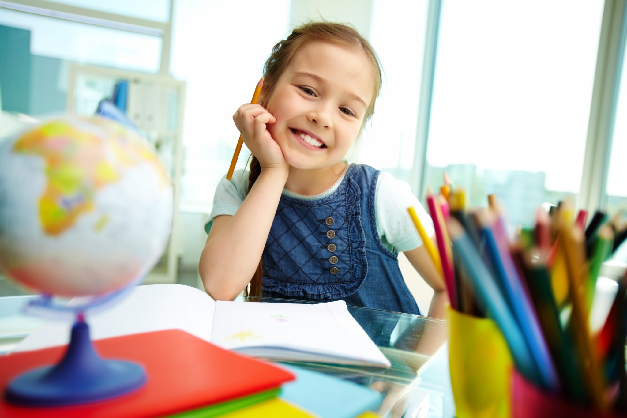 Portrait,Of,Lovely,Girl,Looking,At,Camera,While,Drawing